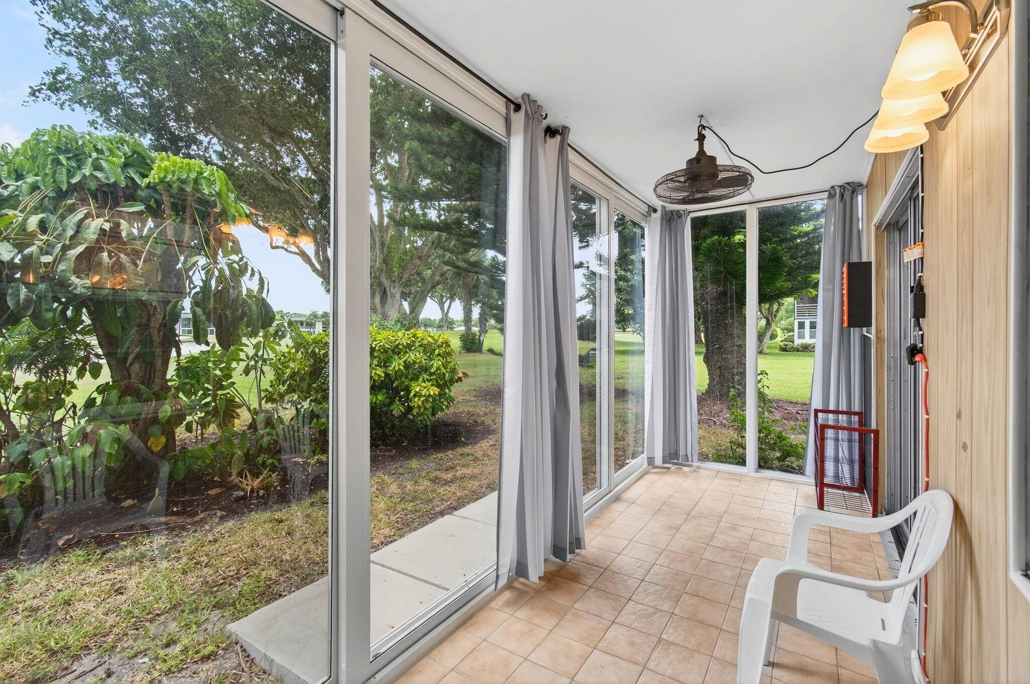 Check out this Ground Floor Corner Unit with Fascinating Golf Course Views !