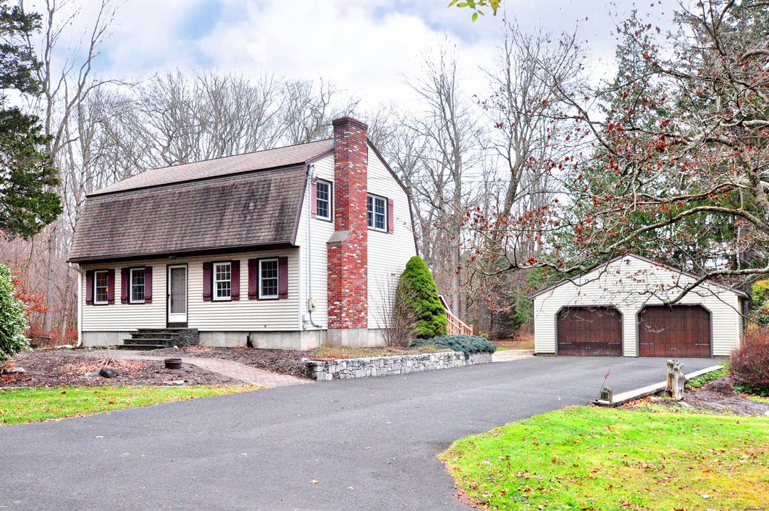 This well maintained Gambrel Colonial with detached two car garage and shed is located on a beautiful level 1.