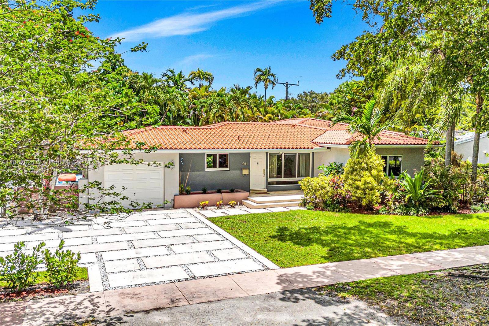Set on a quiet, tree lined street, this beautifully updated Coral Gables home sits on a rare double corner lot with lush landscaping amp ; timeless architectural character.