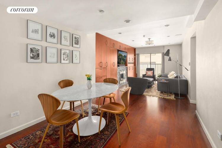 Located on the penthouse level of the historic Cast Iron Building, this bright two bedroom duplex features a large private terrace and a flexible layout.