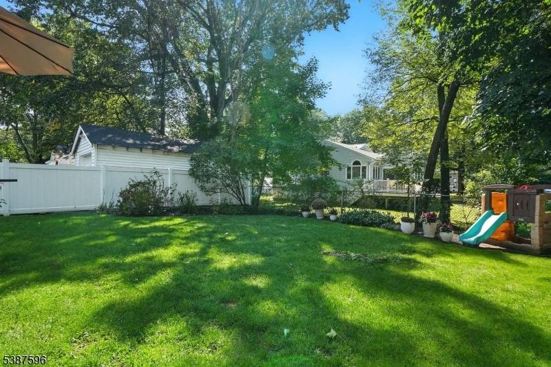 UPDATED STYLISH Cape Cod with 3 Levels of Living Space plus CHARMING Enclosed PORCH.
