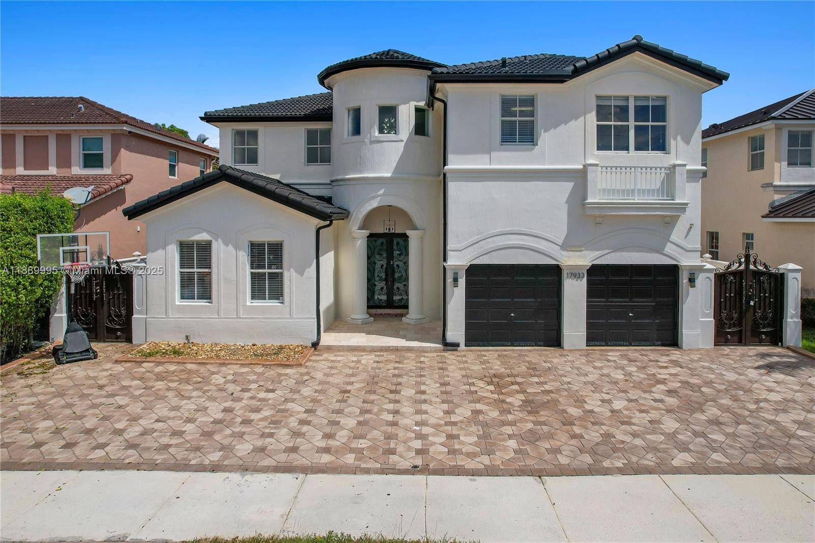 Exquisite 5 bedroom, 5 bath home with a spacious open concept living area filled with natural light.