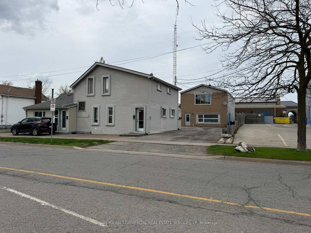 Located on 0. 201 acres. Investment property with 4 residential income producing units and 5 surface parking spaces.