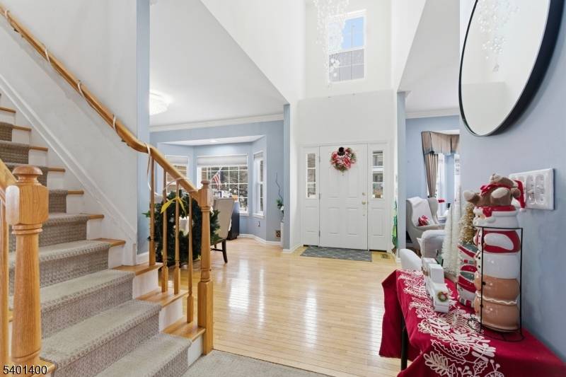 Welcome to your forever home, two story foyer welcomes you with a beautiful layout, Formal living room space with hardwood floors, gas fireplace and bay window.