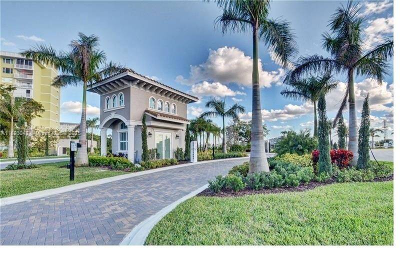 Indulge in elevated waterfront living in the prestigious gated community of Parkview at Hillcrest.