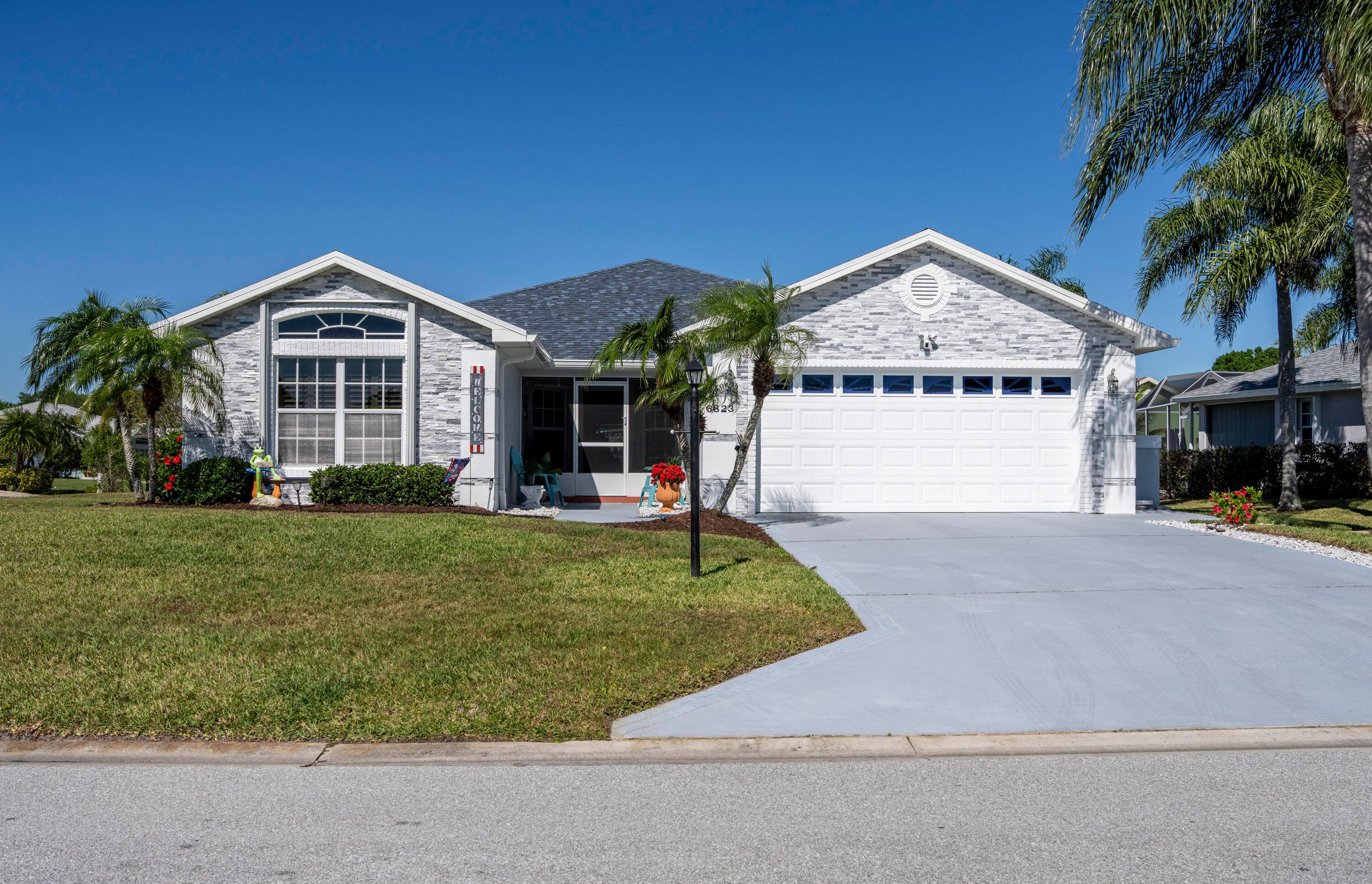 Feel the warmth and pride of ownership in this immaculate 3 bed, 2 bath home on a fenced corner lot in the tranquil Oleander Pines.