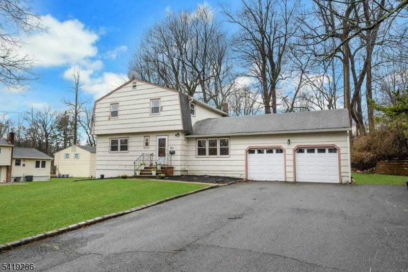 Spacious Colonial in the desirable Cherry Hill section, set on a generous 0.