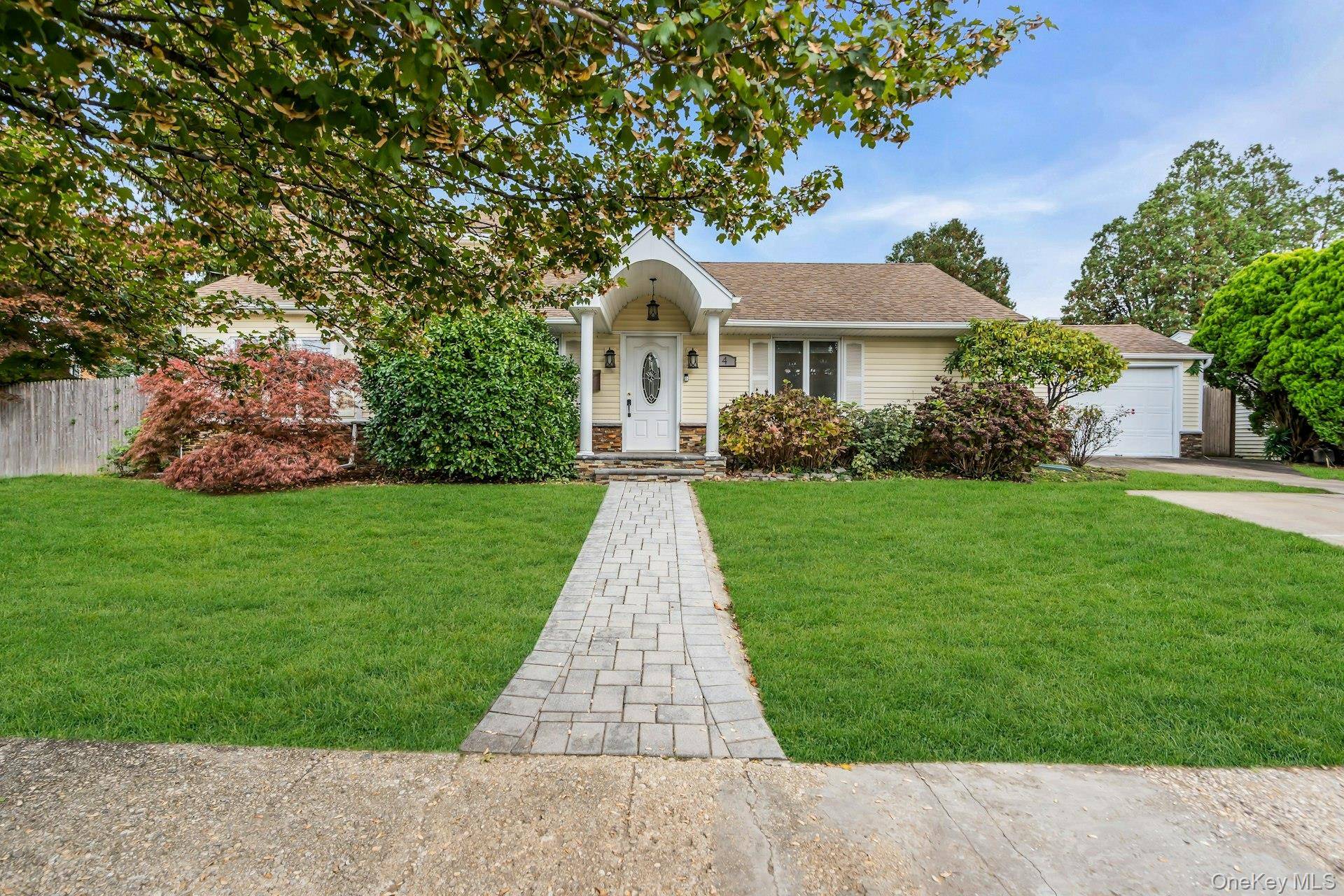 Welcome to this renovated, sun filled 4 bedroom, 2 bathroom home in the highly sought after Syosset School District !