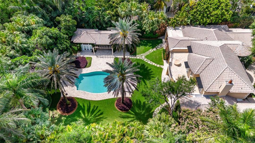 Located in the heart of Ponce Davis, this timeless, wrapped in fully grown ivy estate nestled on a cul de sac behind private gates, offers 6 bedrooms, 6.
