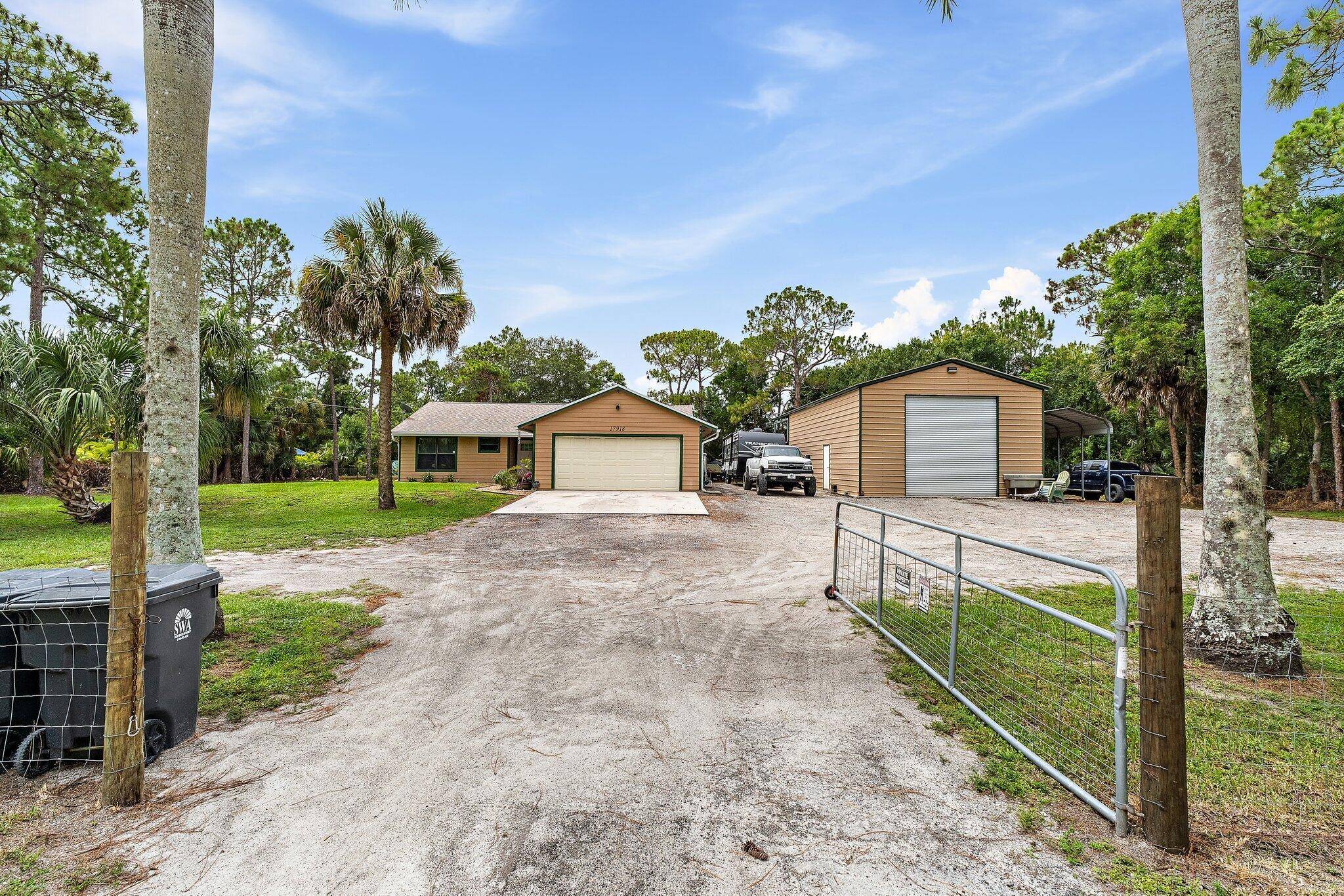 Experience the best of country living with this charming ranch style 3 bedroom, 2 bath home situated on a fully fenced 1.