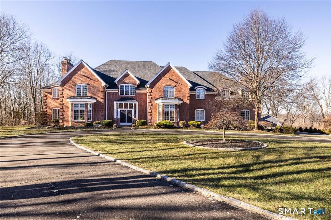Set on a quiet cul de sac in the highly coveted Quaker Farms neighborhood, this exceptional custom Brick Colonial offers a rare combination of privacy, scale, and timeless elegance.