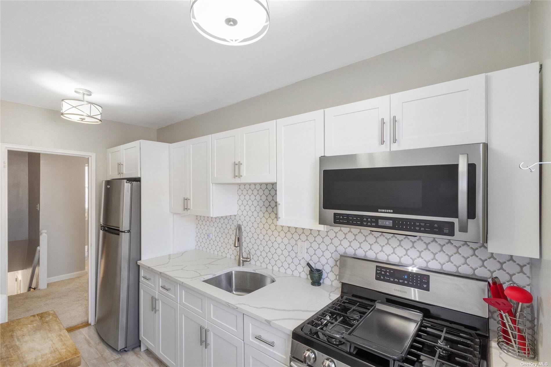 Old Mill Basin STUNNINGLY Beautiful Co op Apartment Elegantly renovated UPPER 1BR apartment ; Samsung stainless steel appliances in renovated windowed kitchen is complete with white cabinetry with new Cambria ...