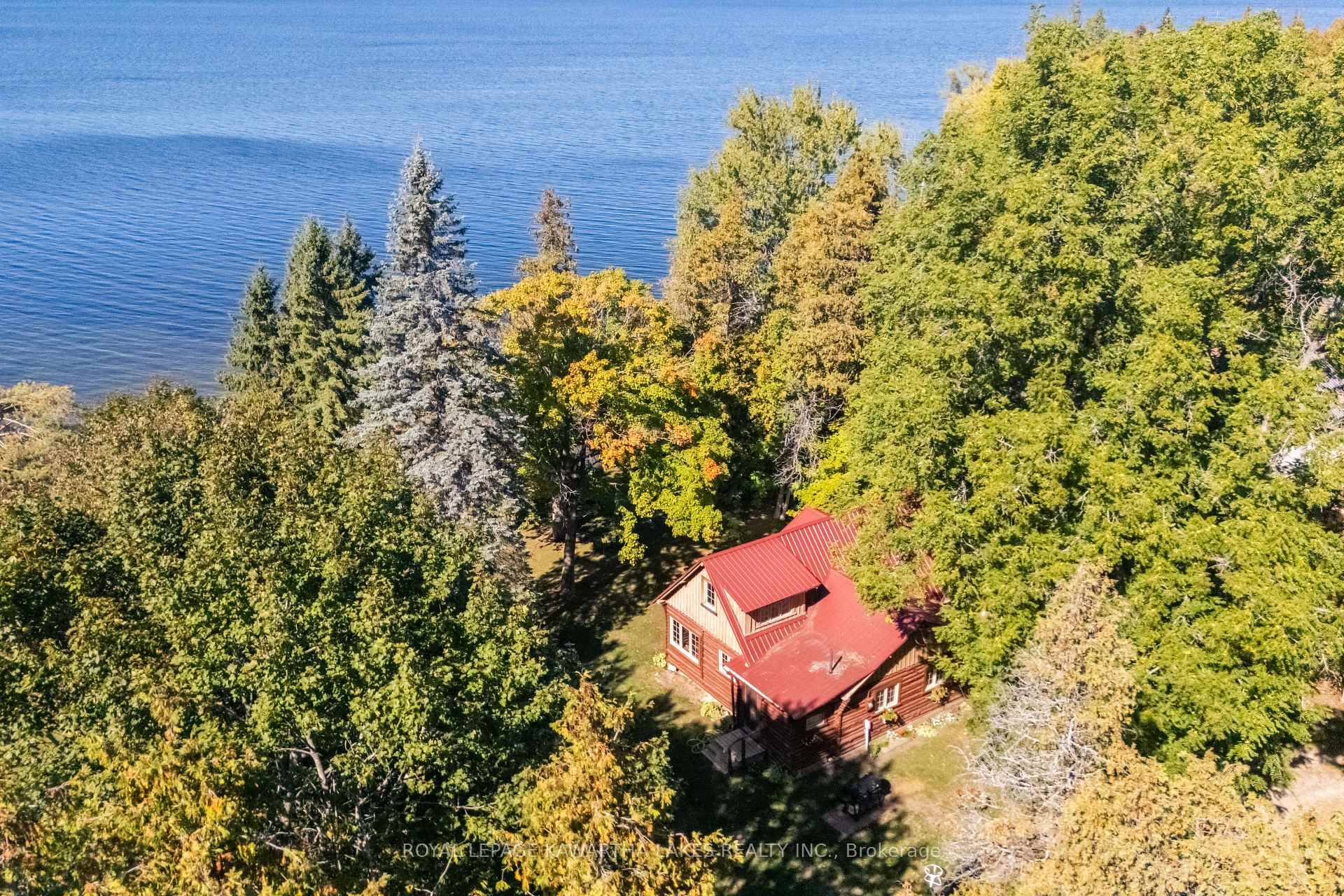 Full acre on Balsam Lake with 100 feet of pristine AAA grade wade in sandy waterfront.