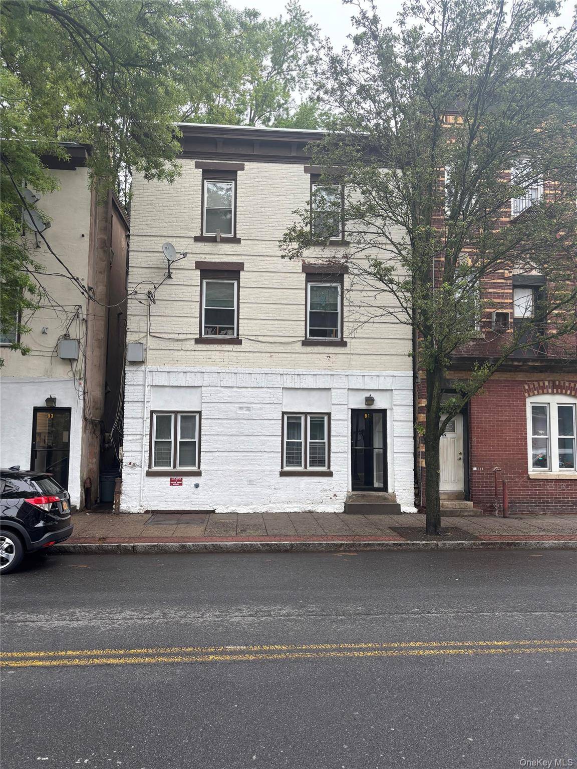 Investors take notice ! This three family property features two one bedroom units and one two bedroom unit, each with its own gas boiler.