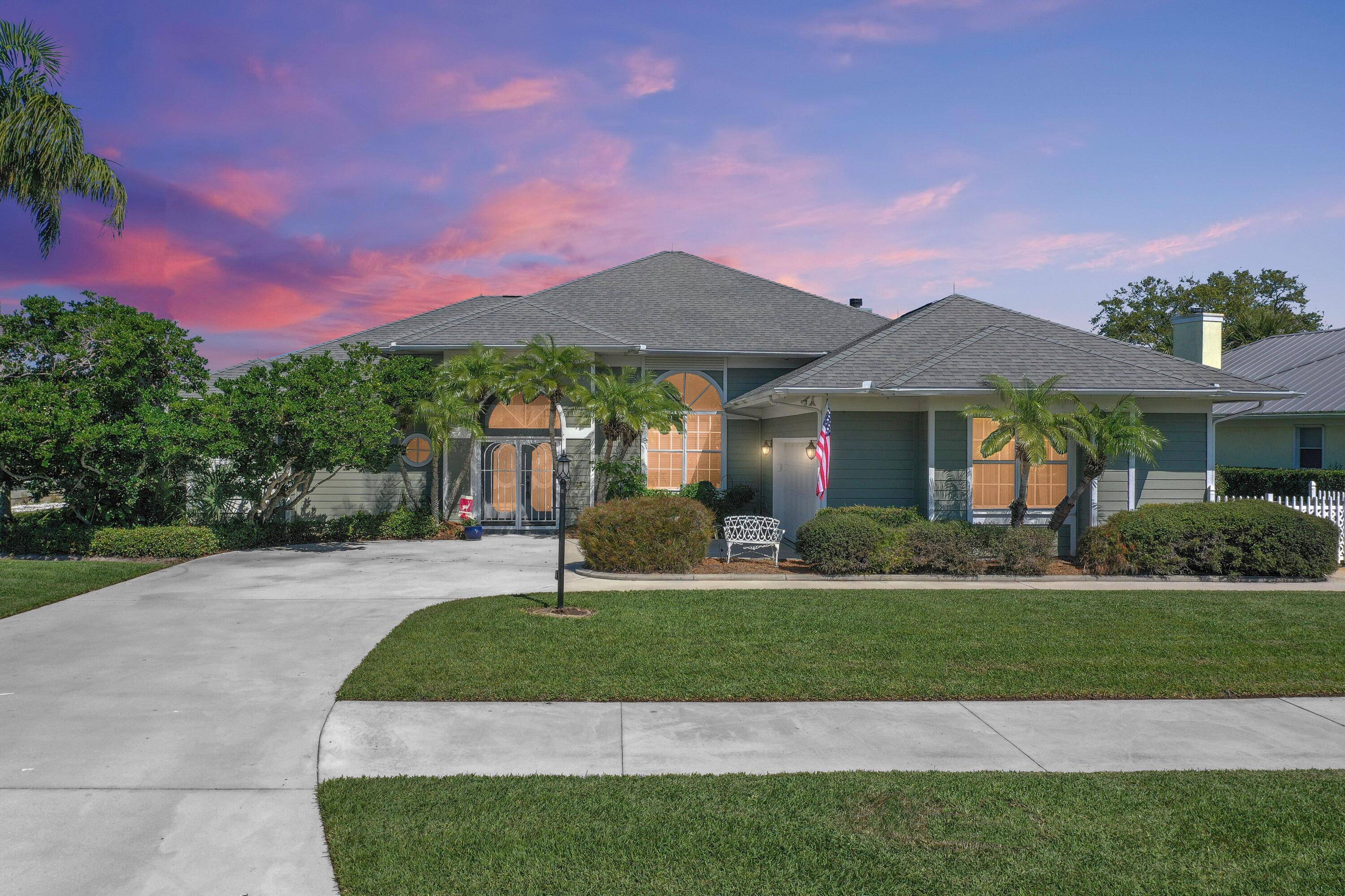 This is it ! Location, spacious elegant best describe this water front home quietly nestled adjacent to the 11th hole of the Gator Trace golf club.