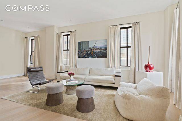 Welcome to this expansive corner three bedroom, three bathroom residence in the historic Ralph Walker Building in Tribeca.