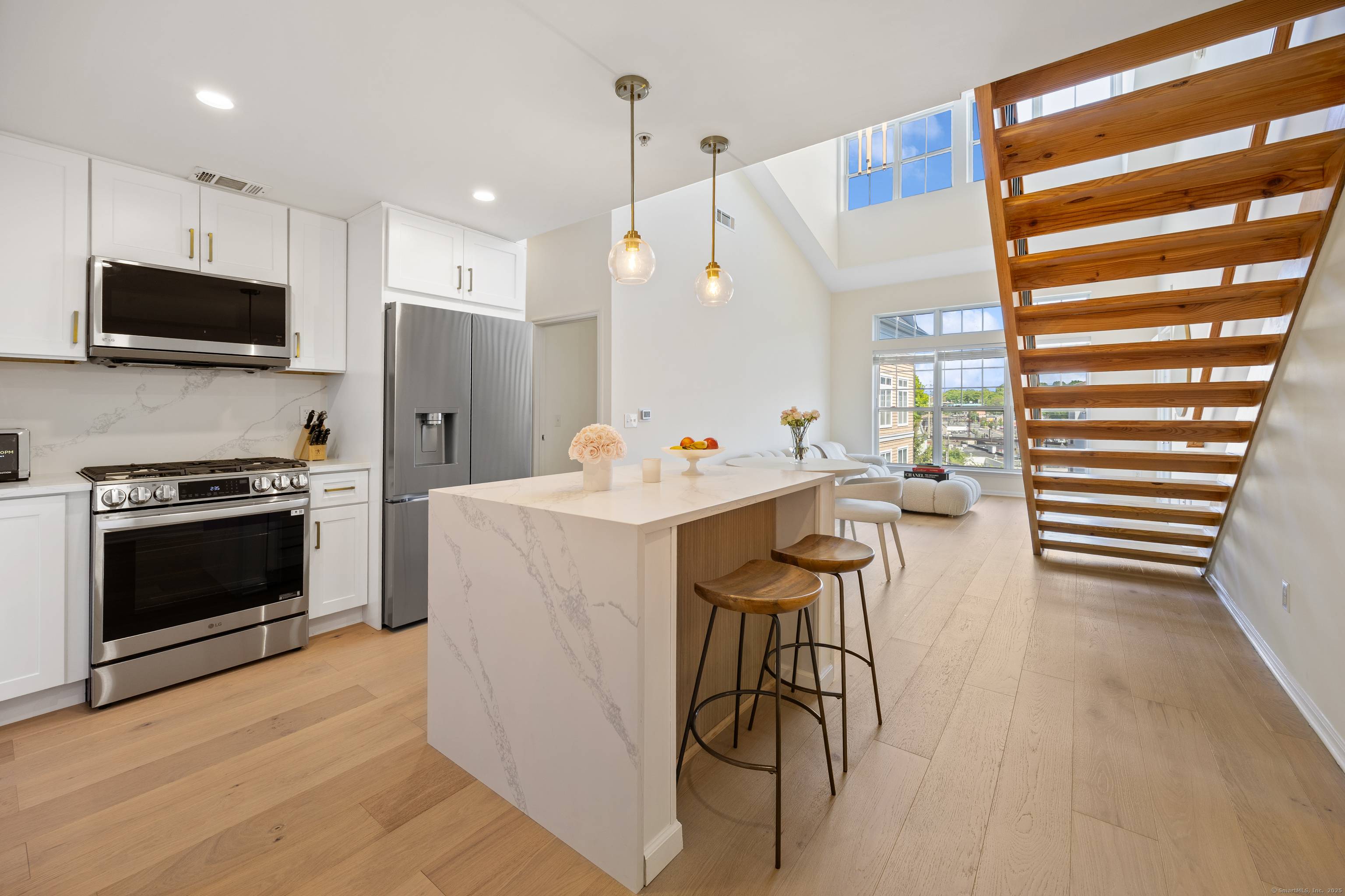 Welcome to this beautifully renovated 2 bedroom, 2 bath, 2 level luxury condo nestled in a meticulously maintained complex in Stamford, CT.
