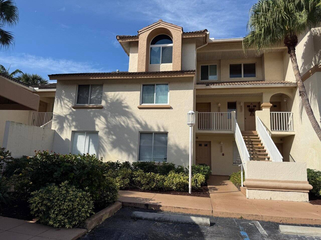 Stunning 2 BEDROOM, TWO LEVEL condo with HIGH CEILINGS, IMPACT RESISTANT WINDOWS, PORCELAIN TILE FLOORING THROUGHOUT in PRIME LOCATION !