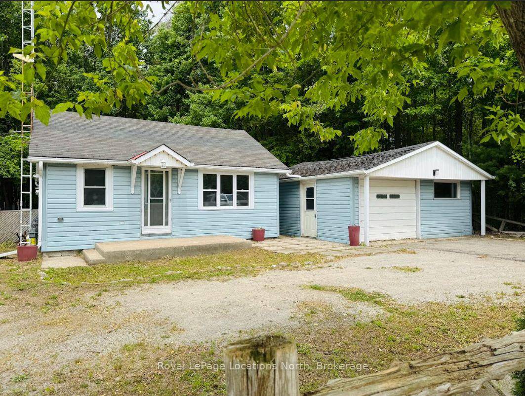 HEATED SHOP ON LARGE LOT This newly updated bungalow that sits on an expansive 350 x 100 ft lot and offers a cozy vibe.