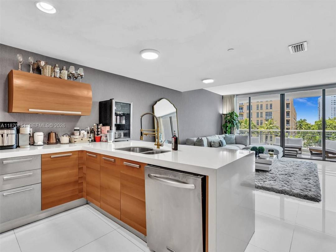 Discover contemporary waterfront condo living in this modern two story residence at Artech in Aventura.