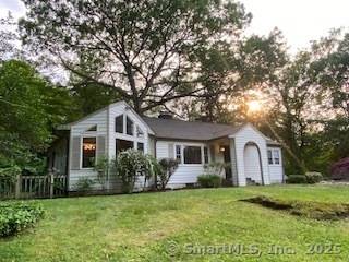 Lovely 2 3 BR ranch with finished walkout level space on a serene private lot, offers the perfect blend of modern elegance and country charm.