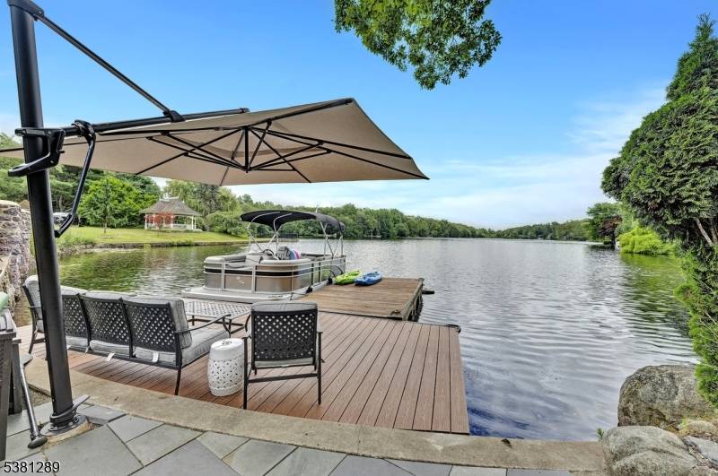 Discover a rare opportunity to own a meticulously maintained lakefront retreat on Kampfe Lake.