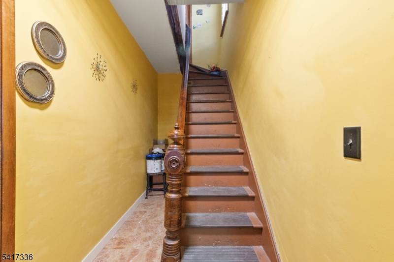 Legal 2 family house with a full finish attic and semi finish basement.