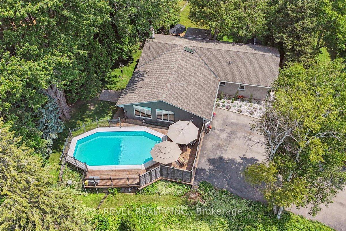 Country in the city ! This custom ranch style bungalow sits on a beautiful.