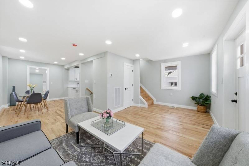 Welcome to 115 Frank St, a masterfully renovated residence in the heart of Somerset that blends modern luxury with versatile living.