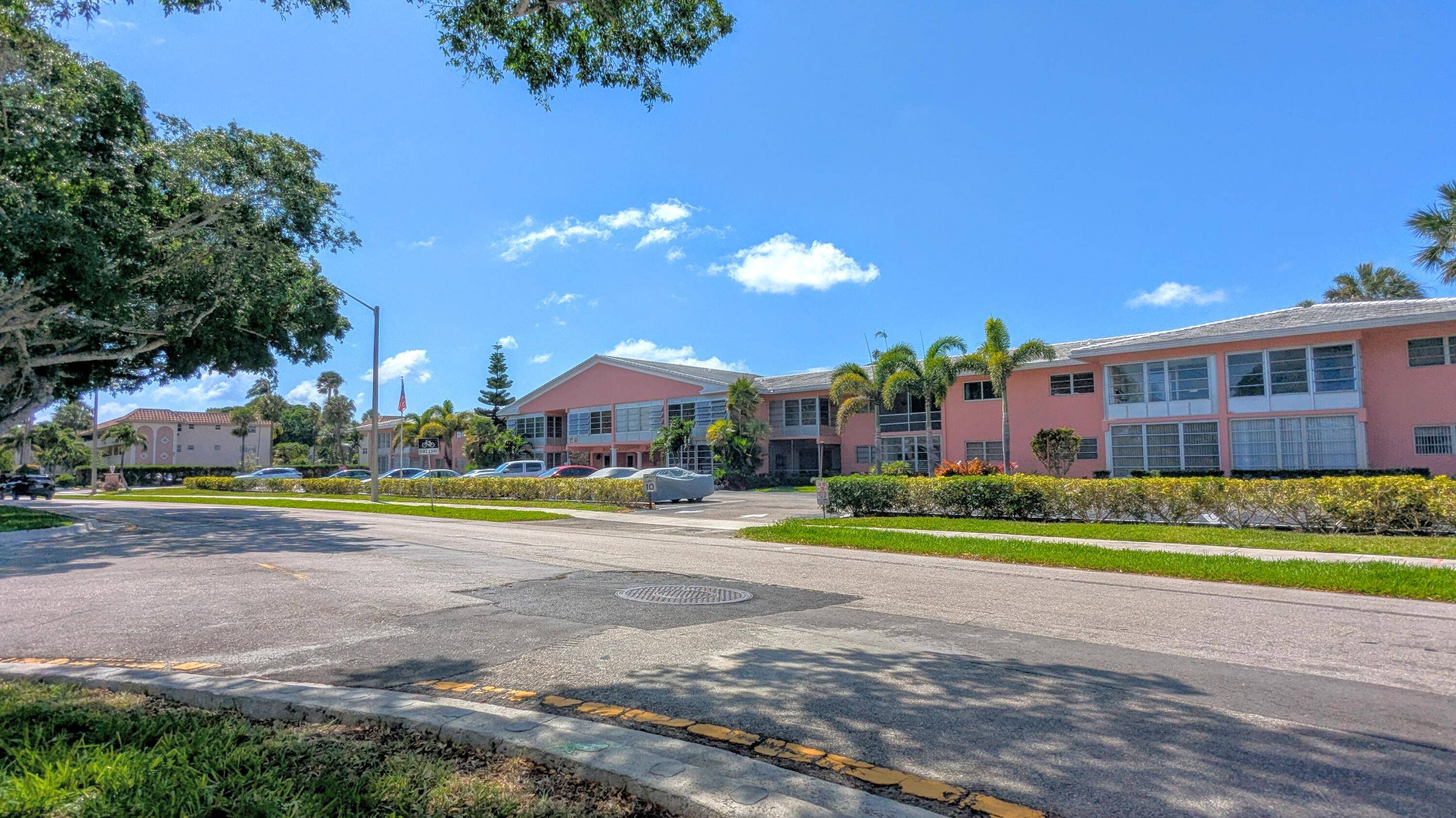 Spacious ground floor one bedroom, one bathroom condo in the 55 Boca Verde community, featuring new laminate flooring.