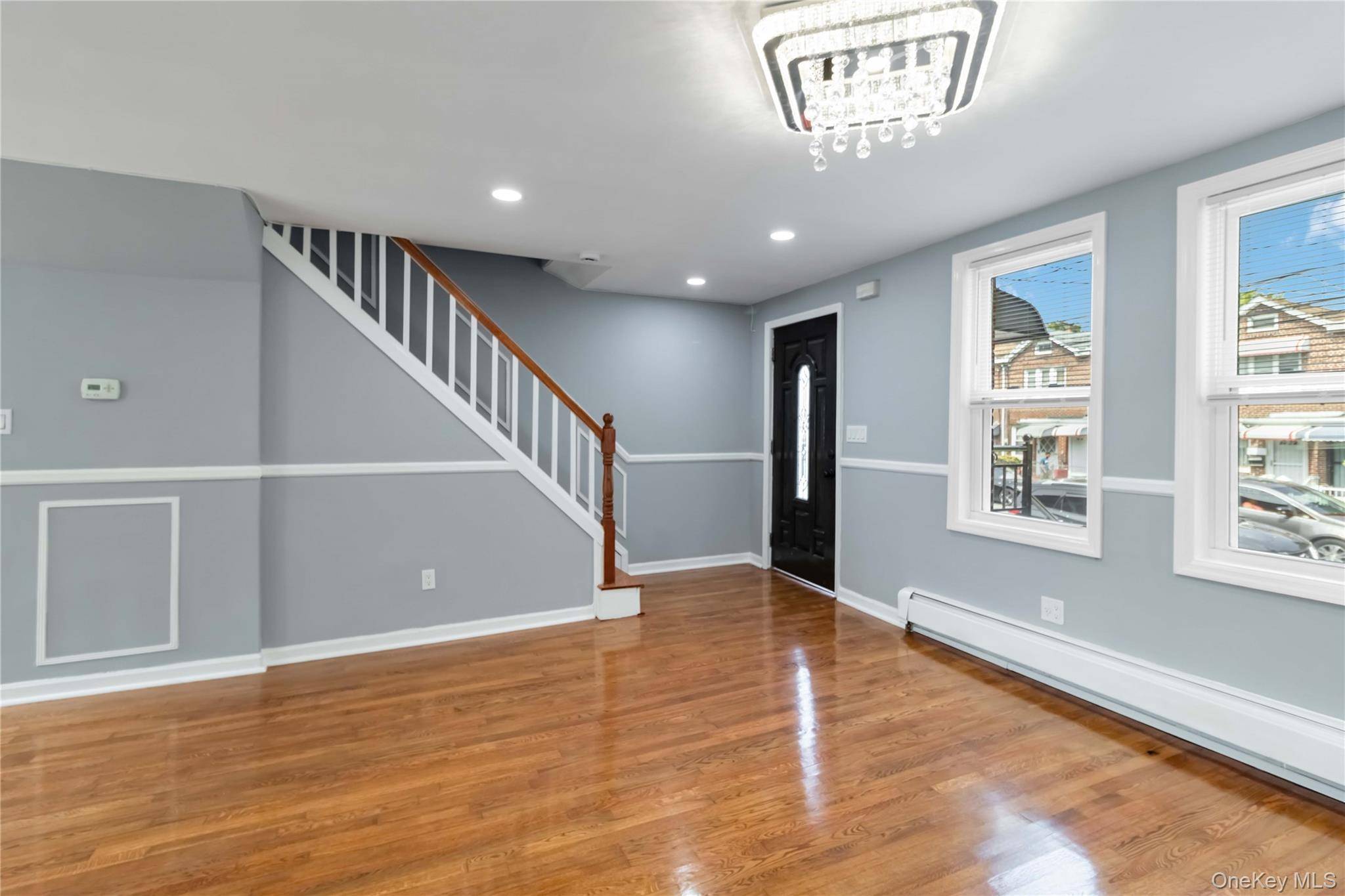 Welcome to this beautifully renovated brick move in ready attached 1 family home on a quiet block in prime Jamaica location.