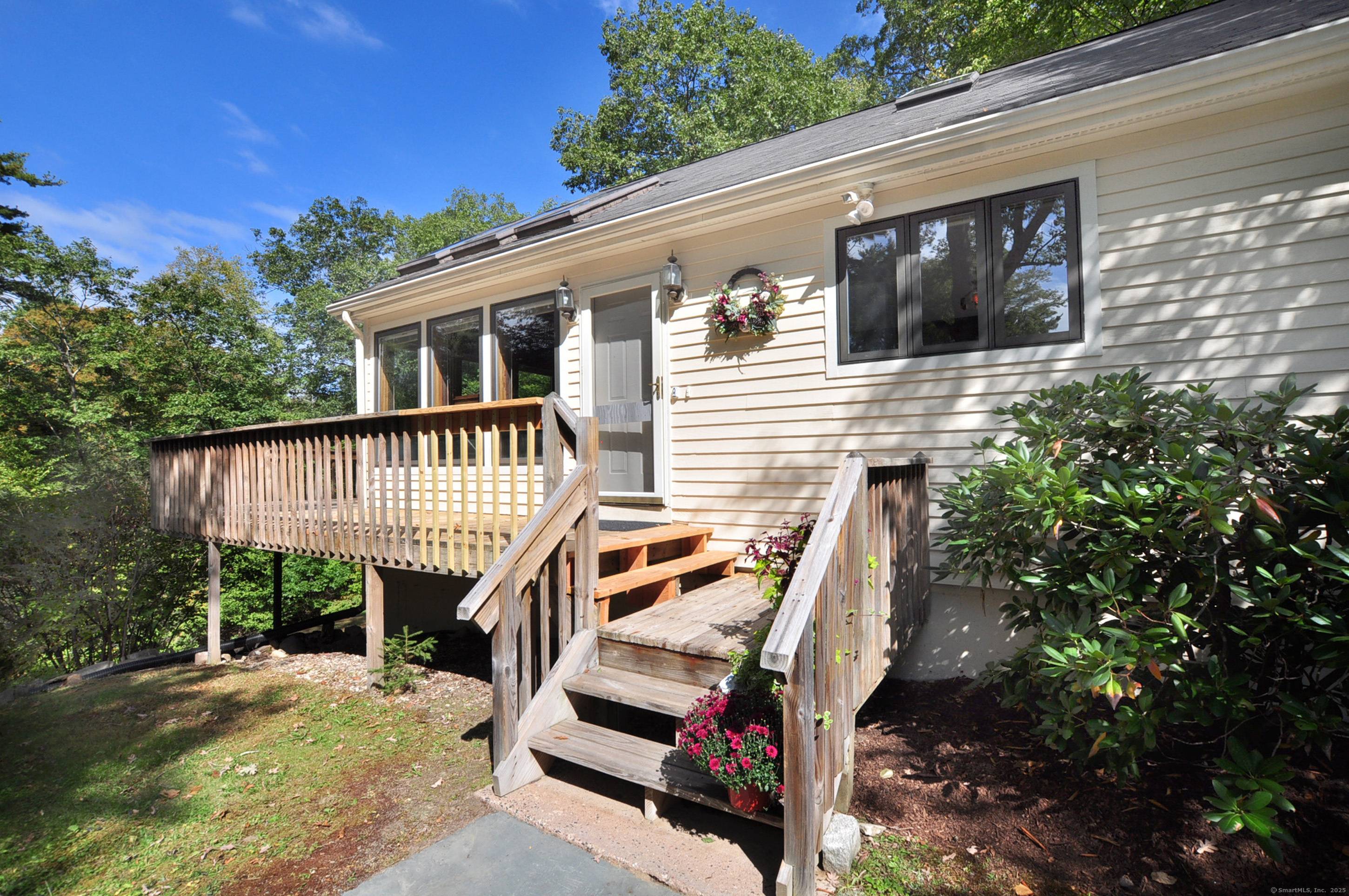 Tucked away on a private, wooded lot, this home offers peaceful views and a versatile layout.