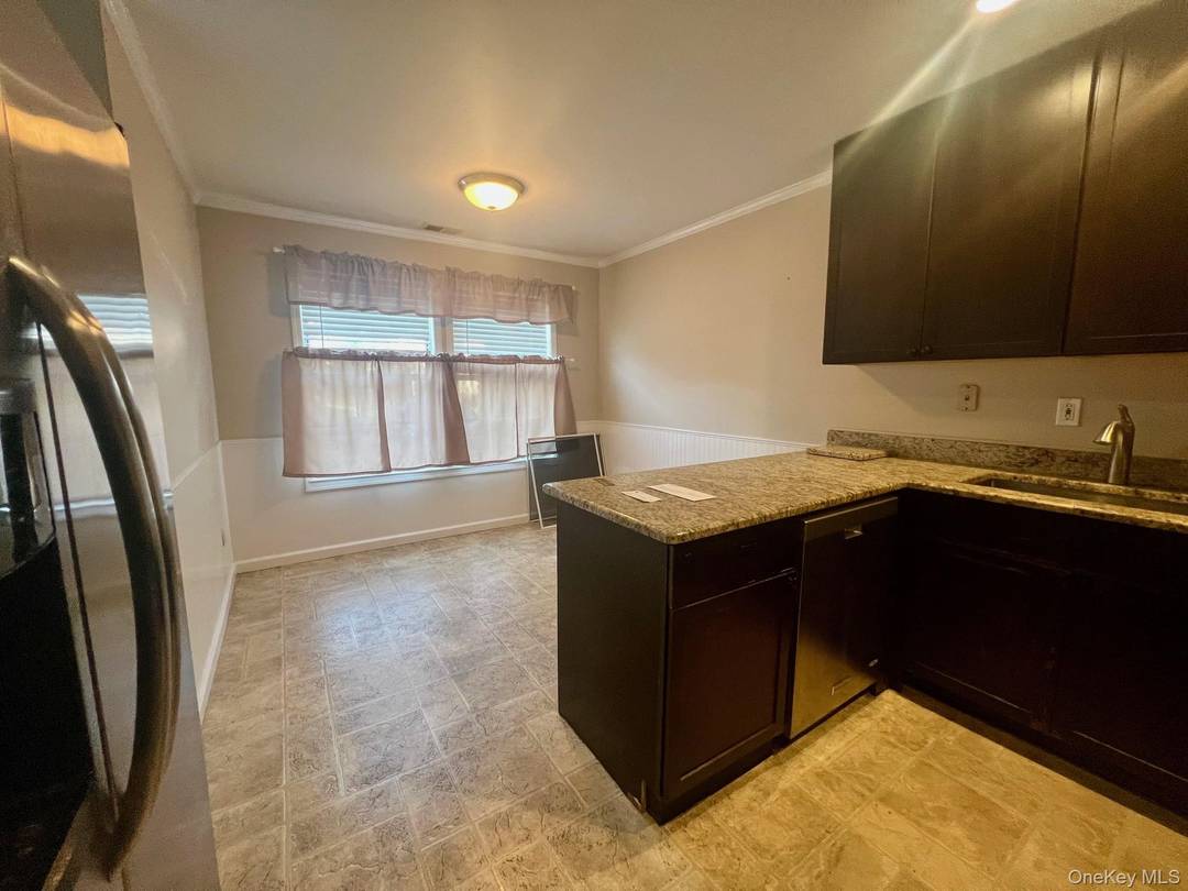 This beautiful and spacious Townhouse Unit Featuring An updated eat in kitchen w Granite Counters, Dining Room, Large Living Room with Sliders to updated patio, Half Bath, Recessed Lighting, And ...