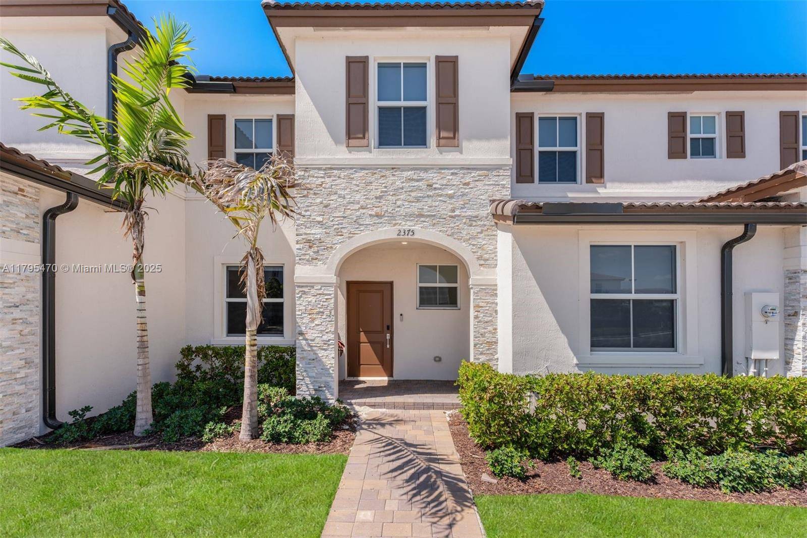 Elegant 4BR 2. 5BA townhouse in Westview, a master planned Miami community.