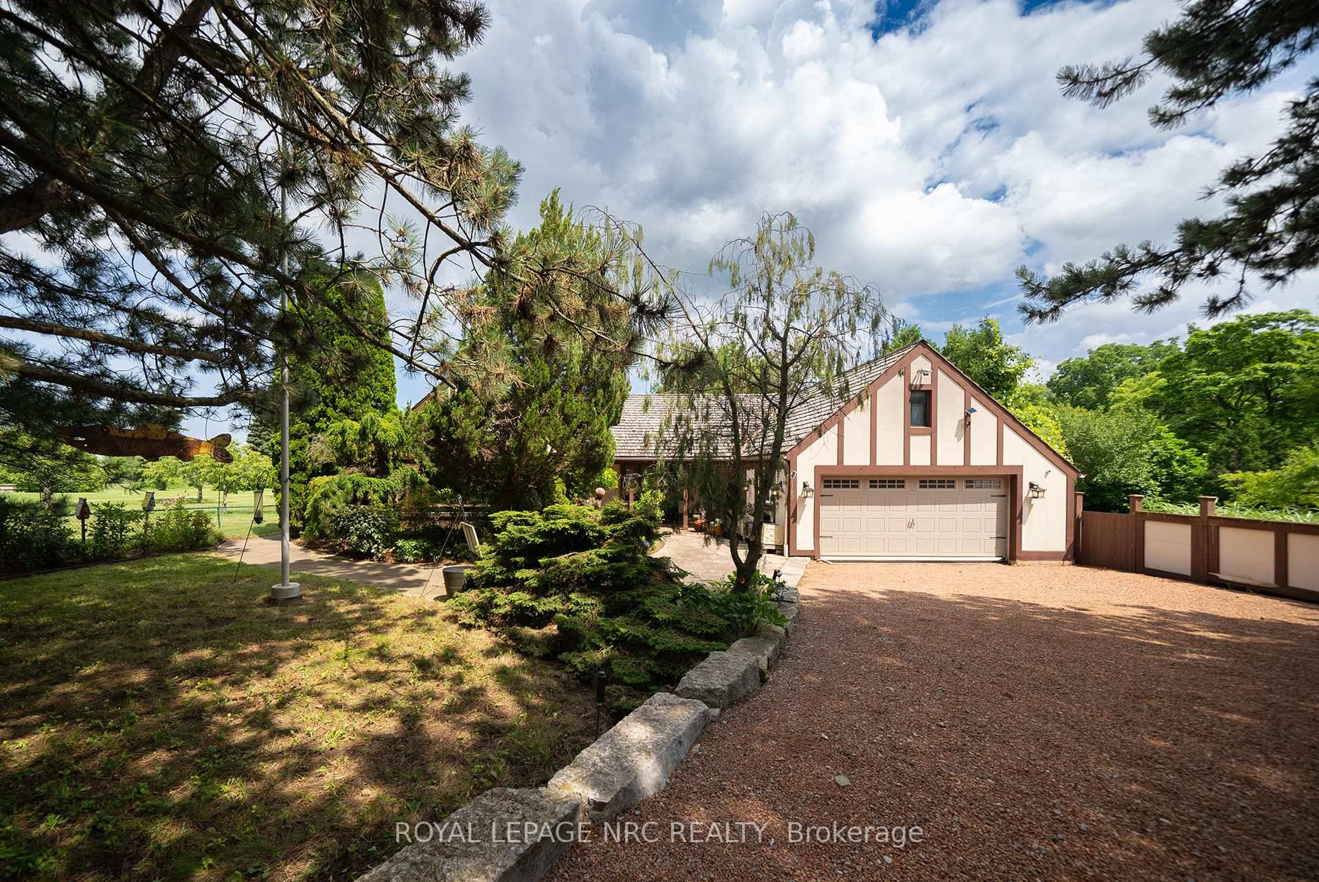This Custom Built Bungalow is a slice of paradise in Niagara's wine country and is nestled on a picturesque 1.