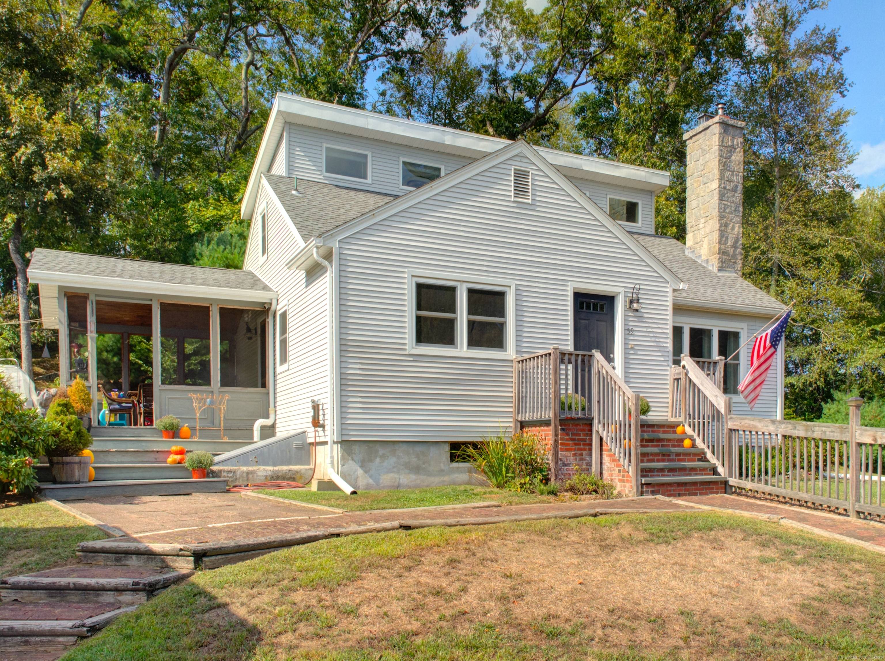 Step into this beautifully updated Contemporary Cape Cod, where timeless charm meets modern convenience.