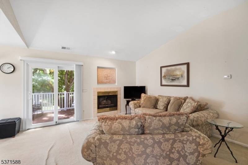 Welcome to this bright and beautifully maintained one level condo, ideally perched on the second floor for added privacy.