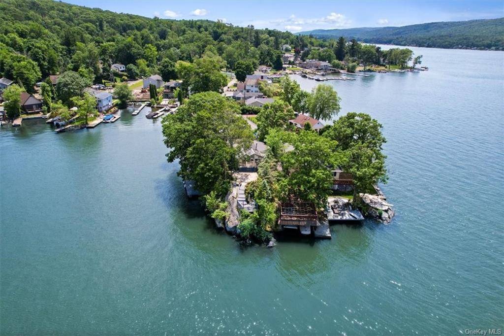 Rule Your Own Waterfront Kingdom Presenting a truly once in a lifetime opportunity to own an impressive historical gem at the end of the legendary West Cove Road.