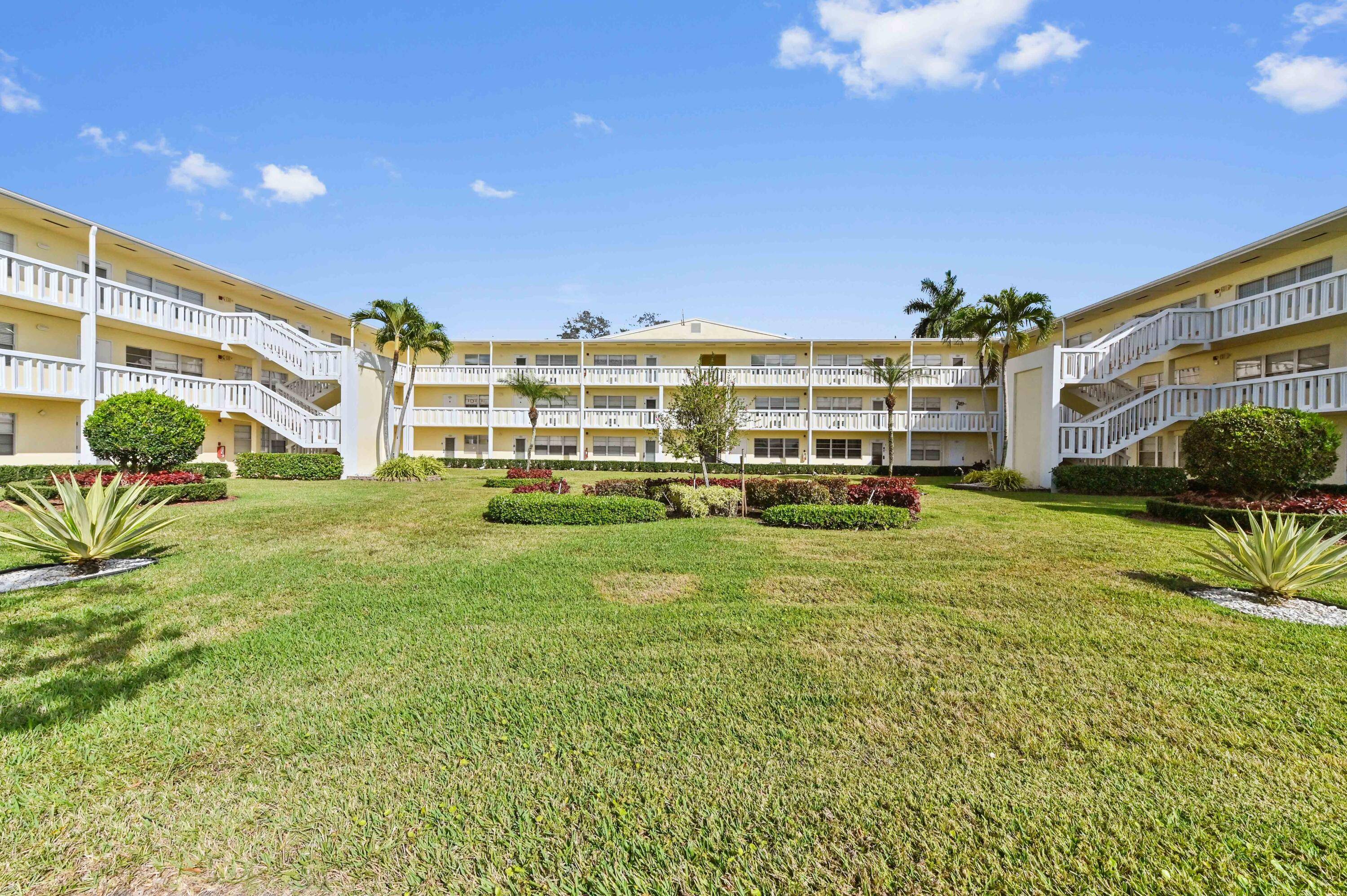 Furnished and turnkey first floor condo in Century Village Boca with serene lake views and a modern interior.