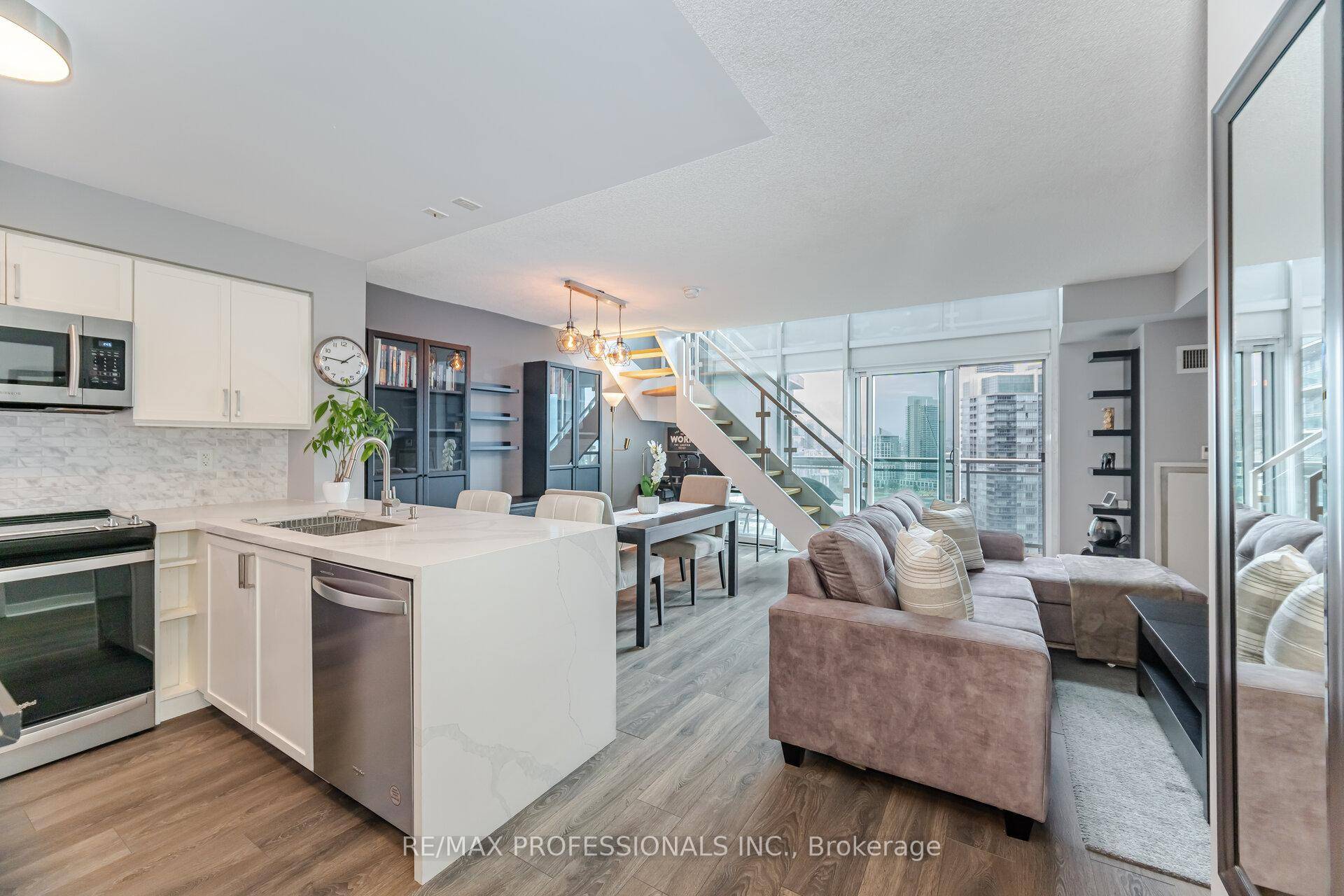 Absolutely gorgeous and spacious 2 story loft filled with an abundance of light through the floor to ceiling windows and breathtaking waterfront views !