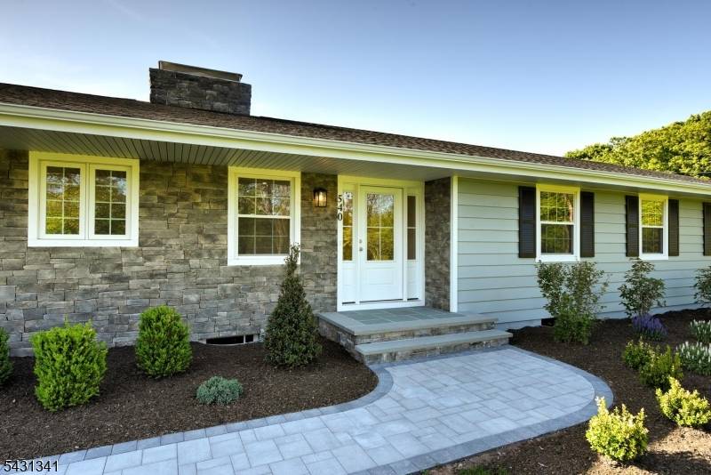 Escape to this secluded 4 acre country retreat with access to the beautiful Neshanic River.