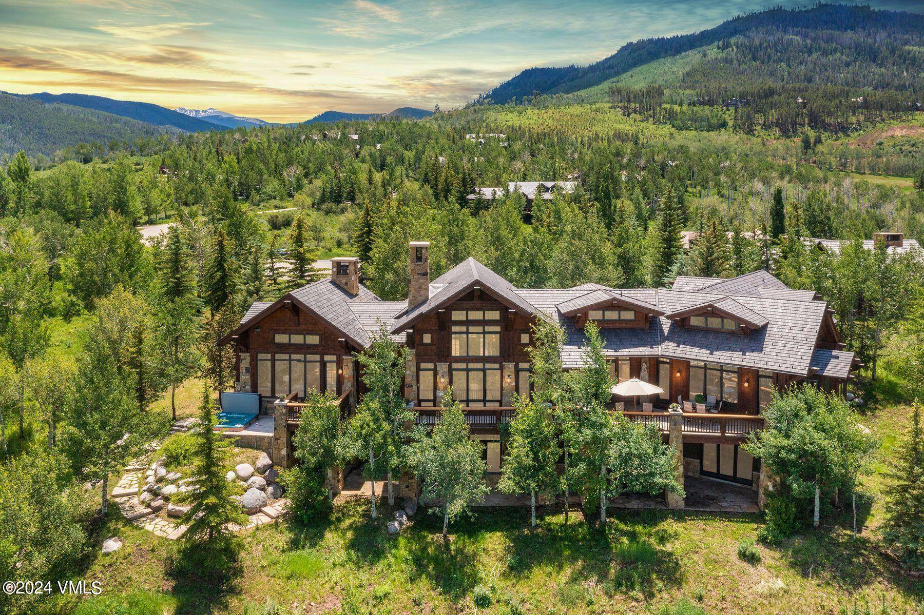 Drive through the gates of Cordillera and arrive at this majestic home set atop the Rocky Mountains.