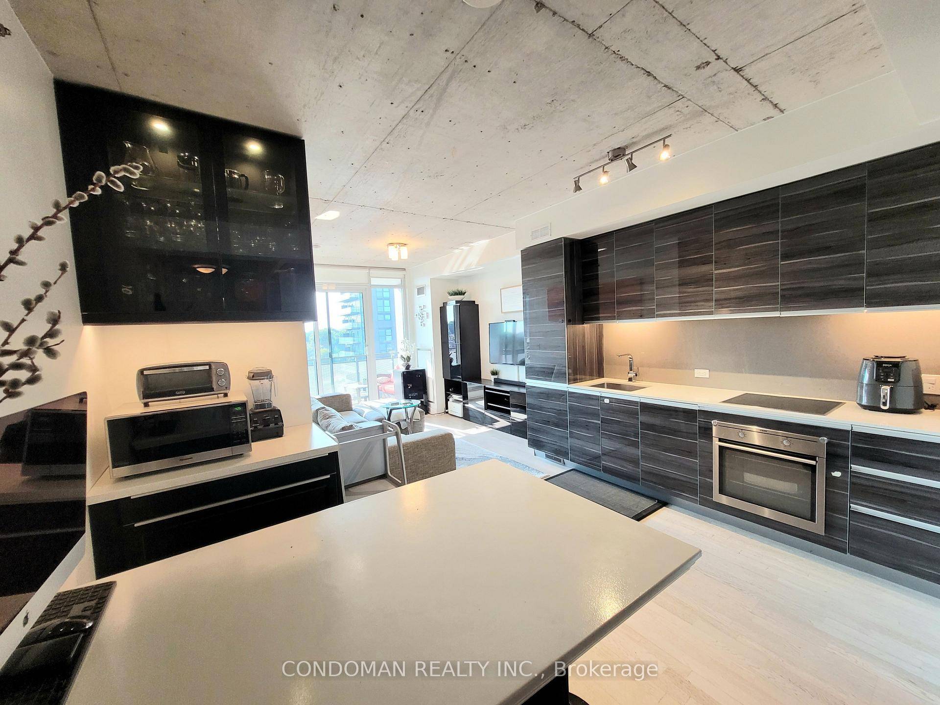 Wow ! Bright, open west view from Gorgeous 2 Bed 2 Bath On Trendy Queen Street West !