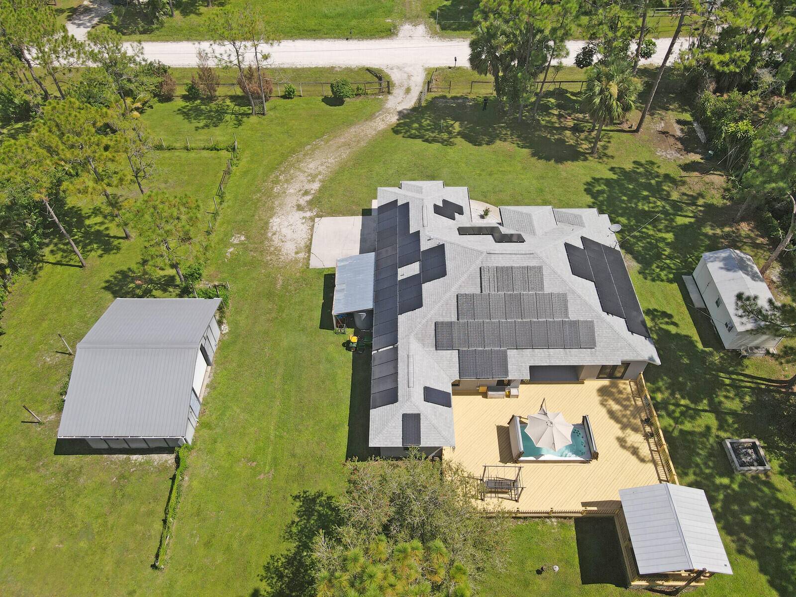 Enjoy wide open spaces, privacy, and the freedom of living without an HOA in this well maintained Loxahatchee property.