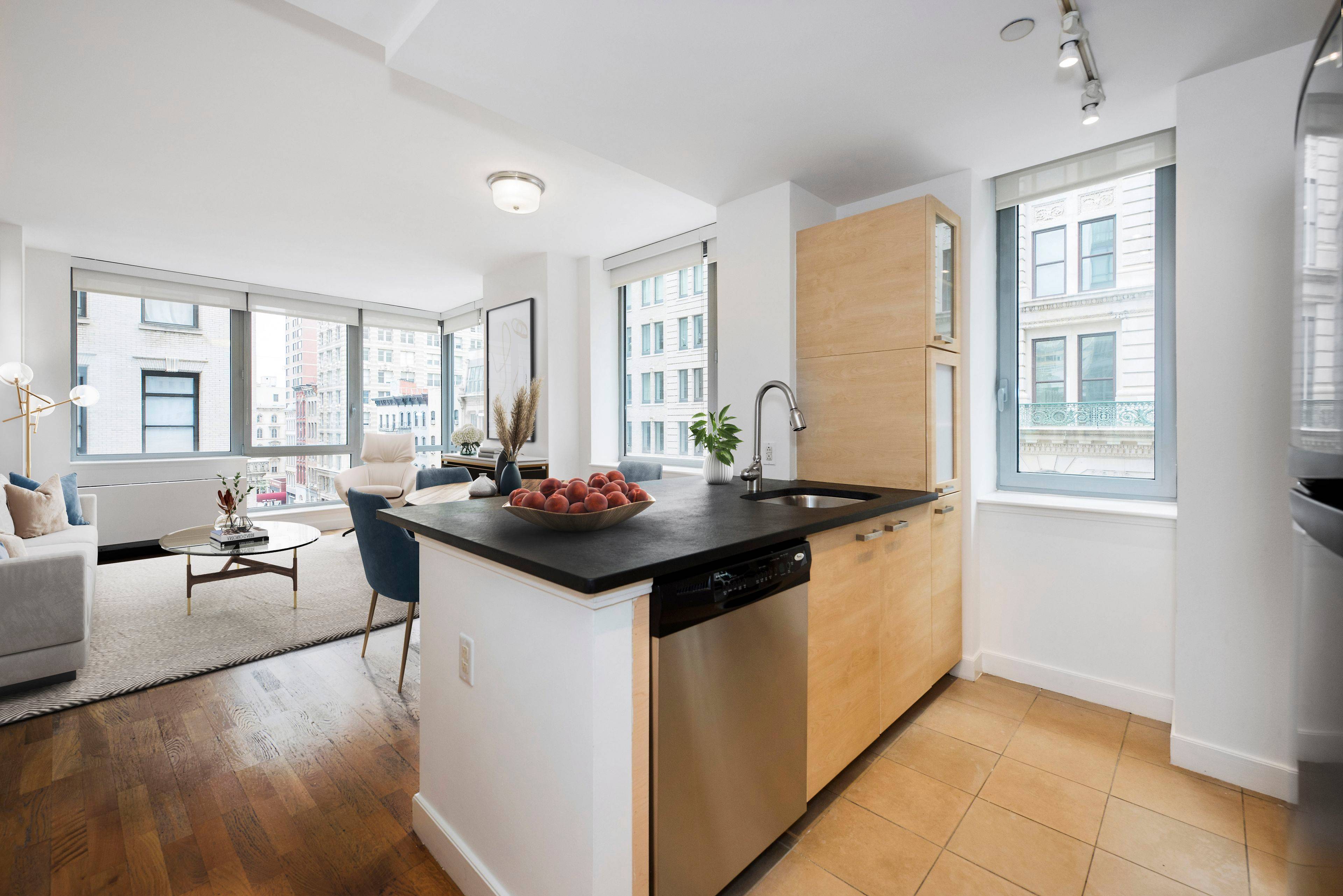 Sprawling, light filled, 1 bedroom with corner floor to ceiling living room windows, a windowed gourmet kitchen with stainless steel appliances, honed concrete tile floors, and granite countertops.