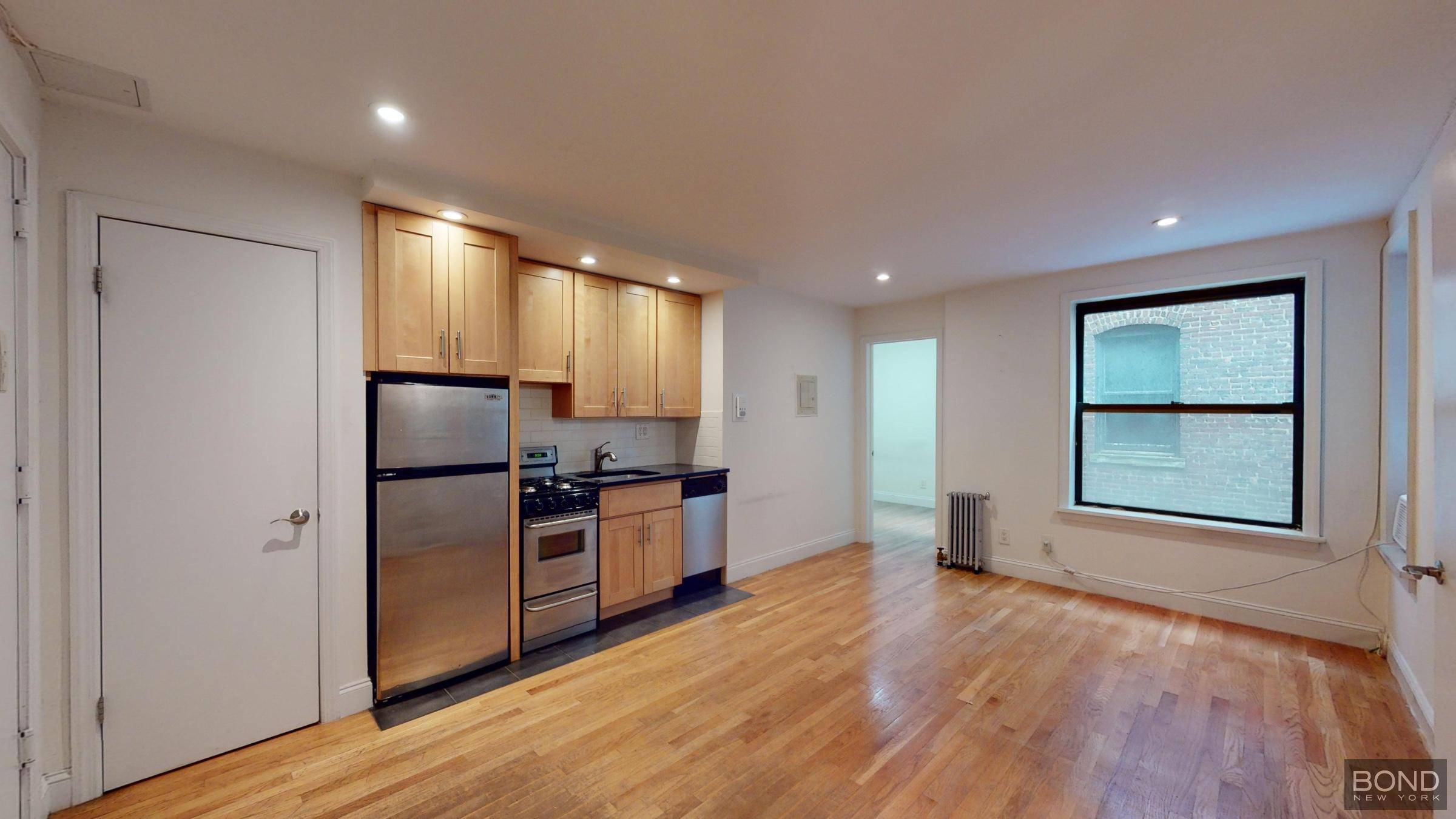 Renovated 1 bedroom apartment features spacious living room, an open kitchen with stainless steel appliances and a dishwasher, queen size bedroom, hardwood floor and high ceilings.