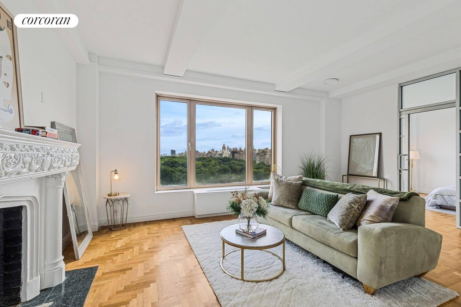 This stunning Central Park South residence offers sweeping, panoramic views of Central Park through picturesque oversized windows.