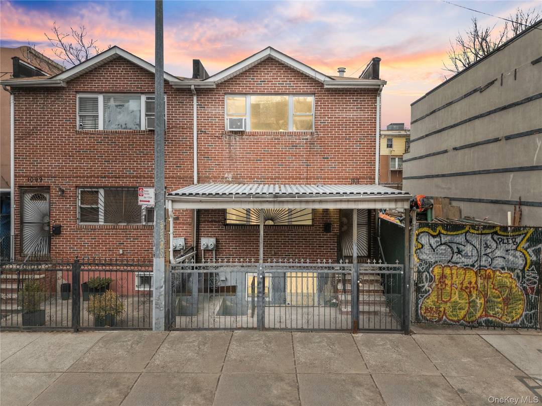 Investor Opportunity ! Solid brick semi detached two family property featuring two spacious 3 bedroom, 2 bathroom apartments and a finished walk out basement.
