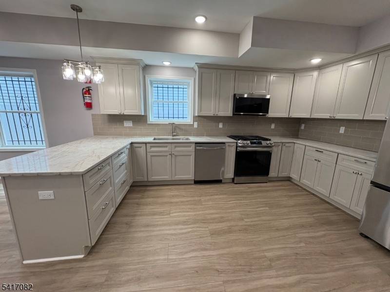 Welcome To This Stunning Newly Constructed two Family Home Offering Modern Finishes, Well Designed Living Spaces and Excellent Investment Potential.