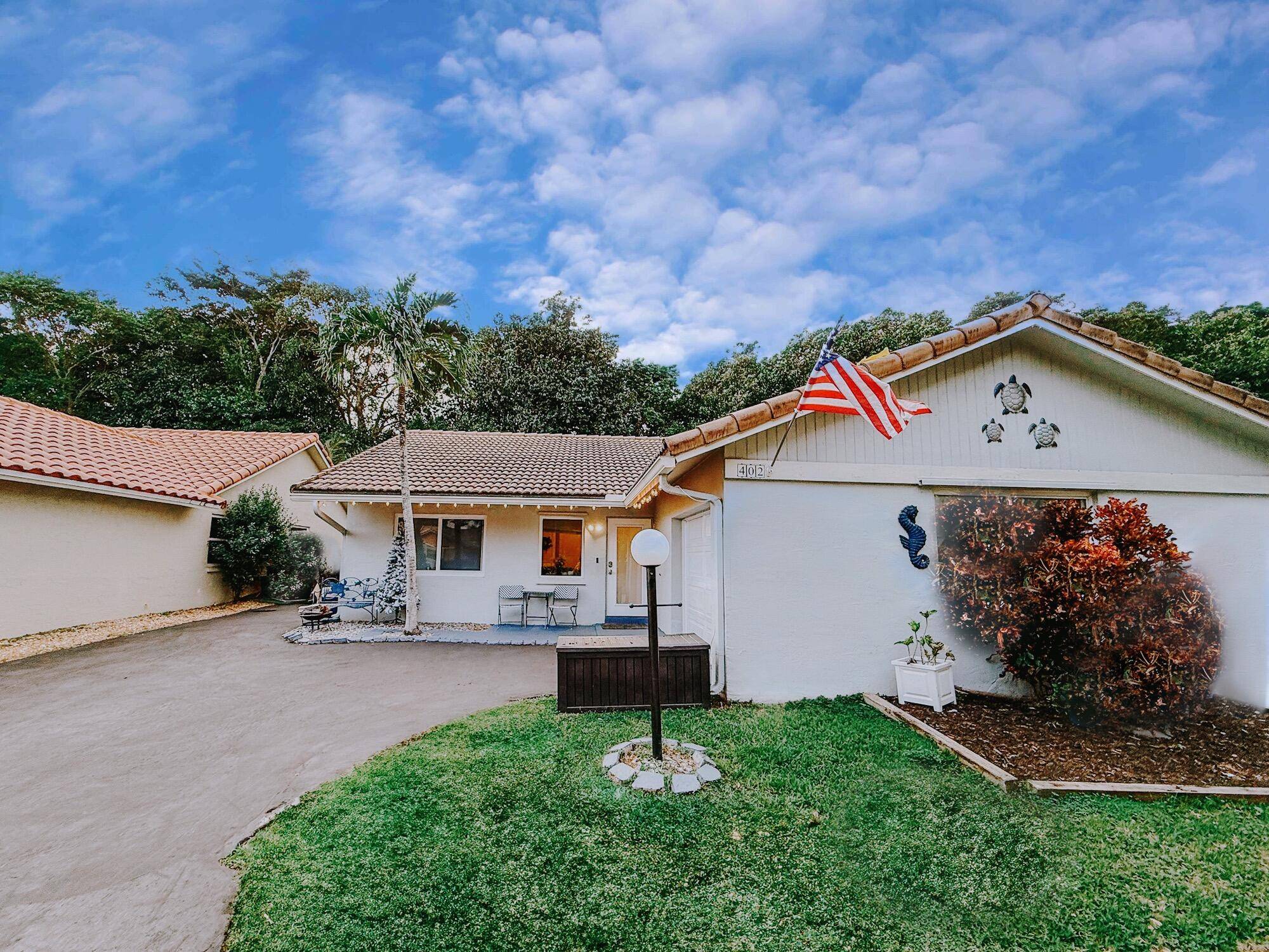 Discover this stunning home in the sought after Shadow Wood Villas, located at the corner of University Drive and Riverside Drive, just minutes from premier shopping, dining, and entertainment.